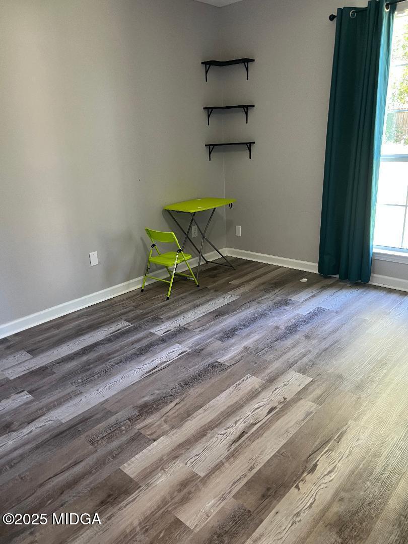 198 Apple Valley Road Macon, GA 31217 - Photo 9 of 12 a wooden bench sitting in middle of a room