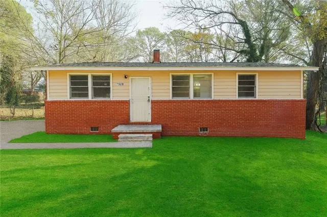 front view of a house with a yard