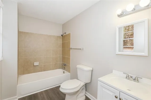 a bathroom with a sink toilet and bathtub