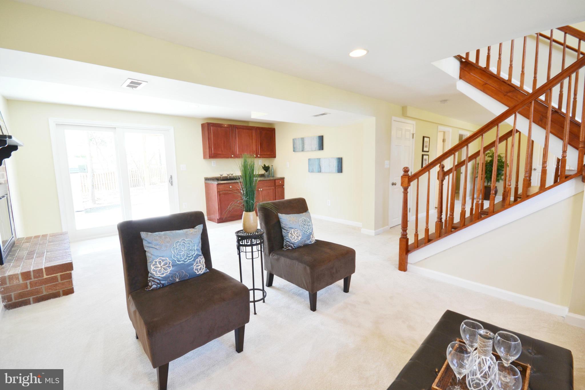 7524 Lemon Tree Court Hanover, MD 21076 - Photo 22 of 30 Family Room w/ Wet Bar and Brick Fireplace