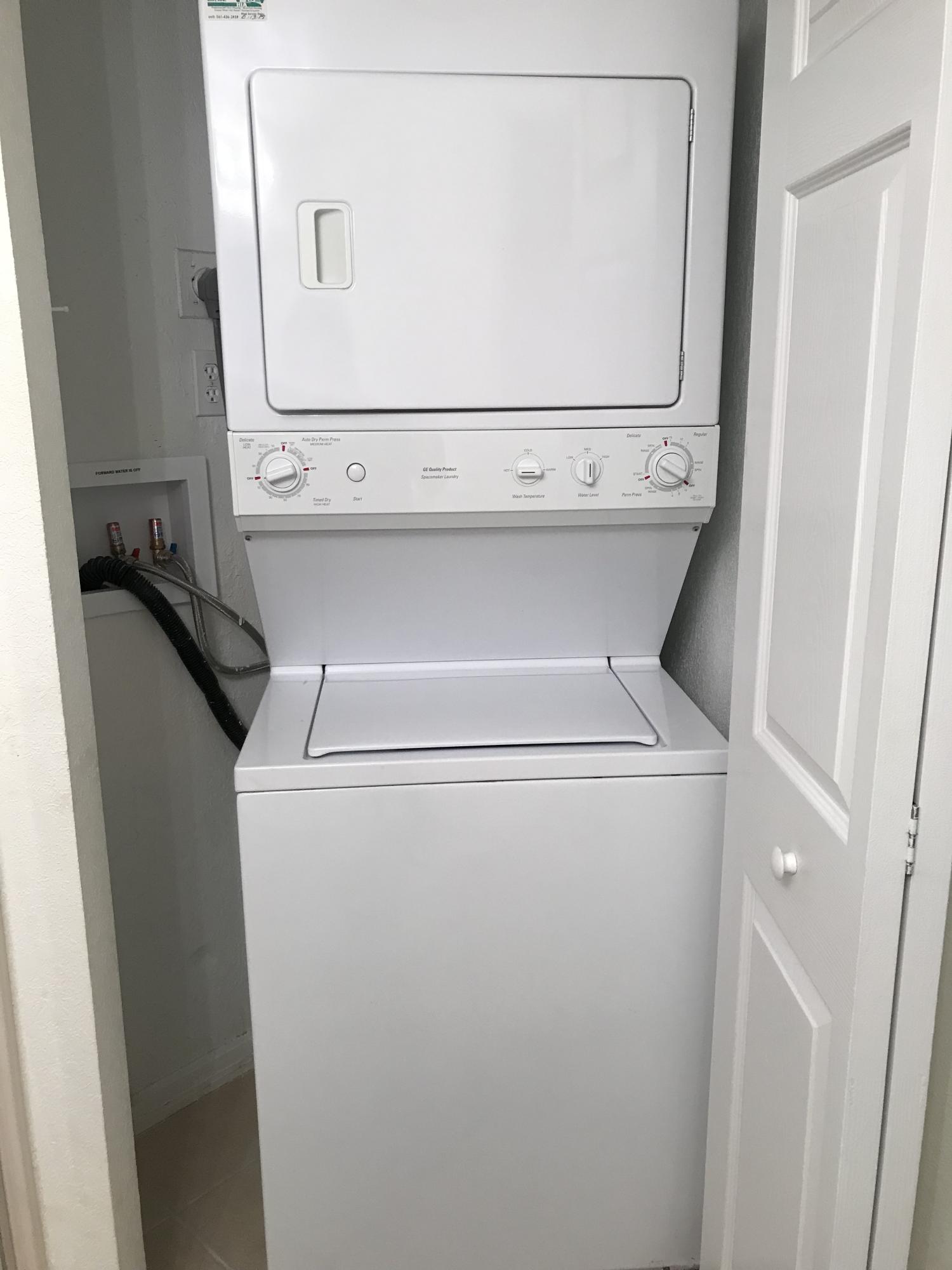 8249 Thames Boulevard, Unit B Boca Raton, FL 33433 - Photo 14 of 46 a close up view of washer and dryer