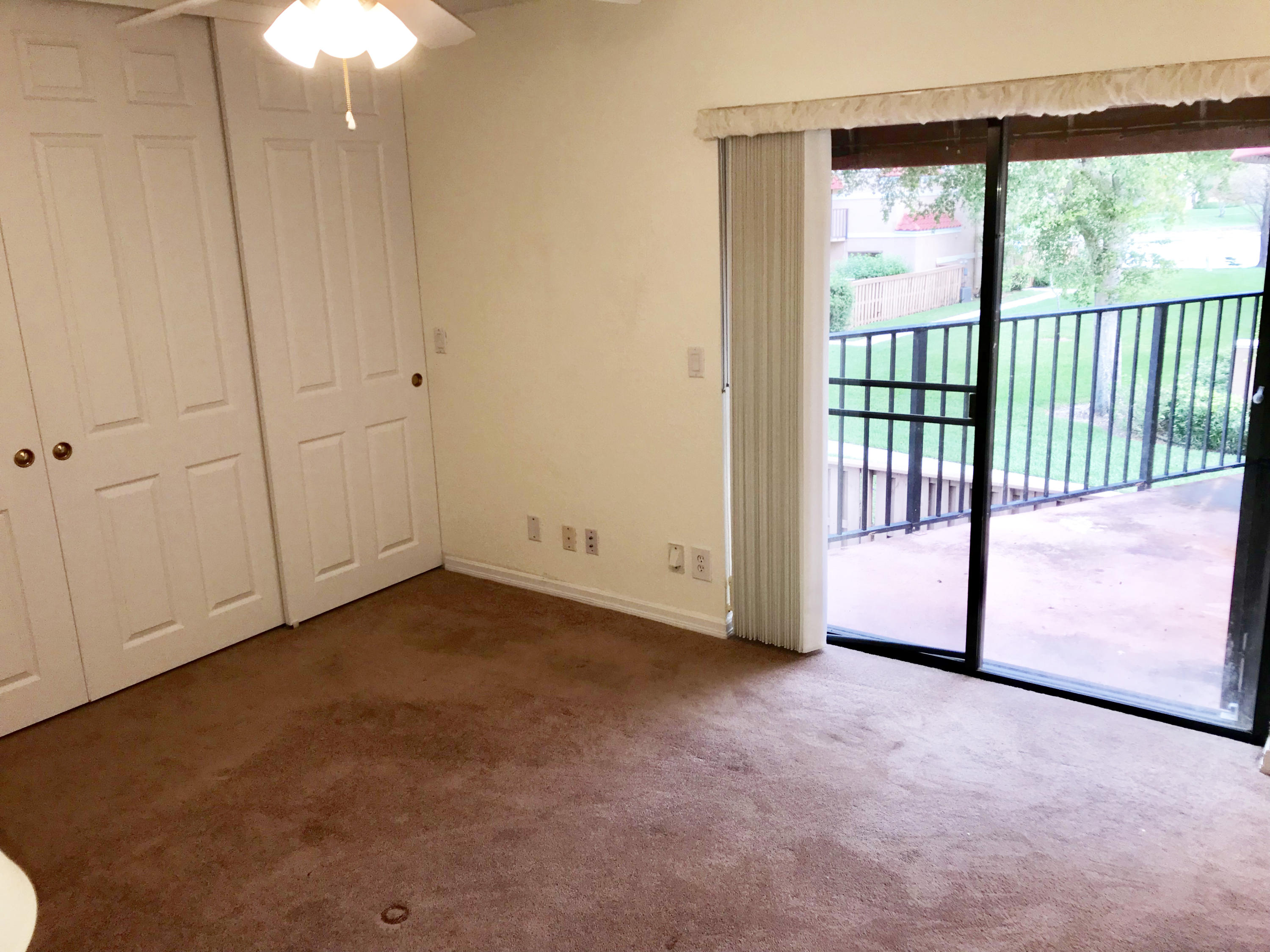 8249 Thames Boulevard, Unit B Boca Raton, FL 33433 - Photo 21 of 46 a view of an empty room with a window