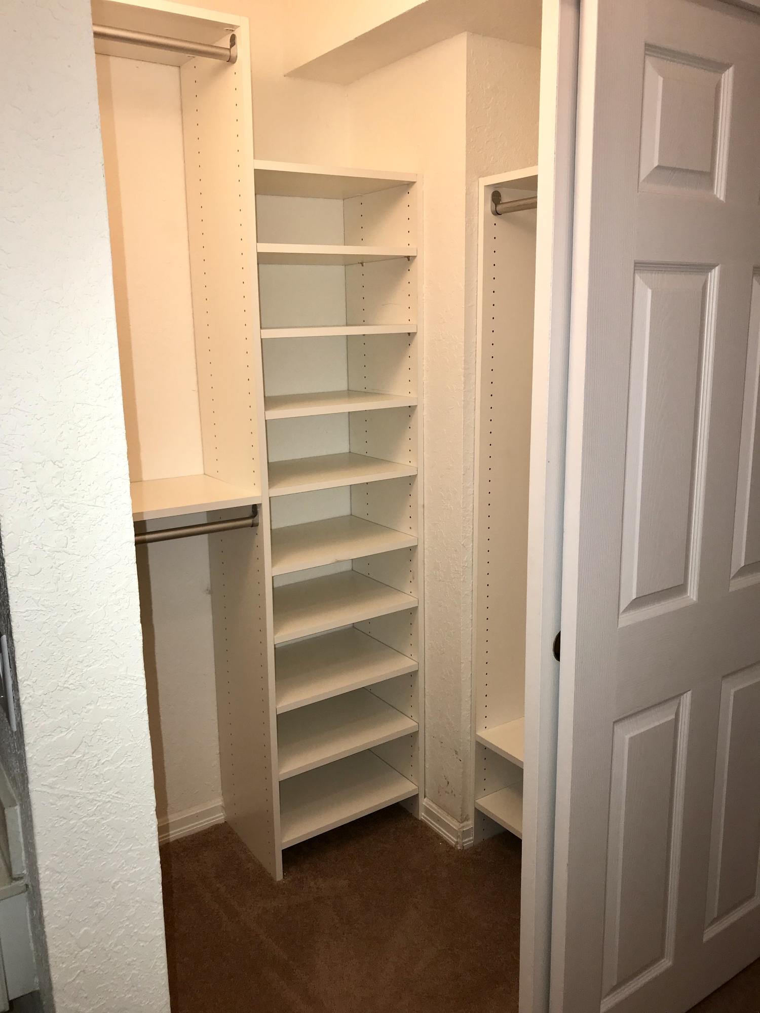 8249 Thames Boulevard, Unit B Boca Raton, FL 33433 - Photo 24 of 46 a view of walk in closet with empty racks