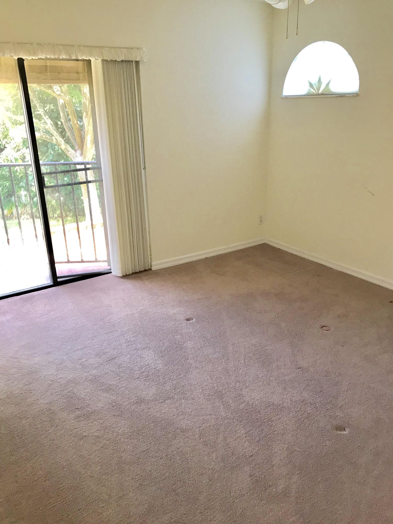8249 Thames Boulevard, Unit B Boca Raton, FL 33433 - Photo 27 of 46 an empty room with a window