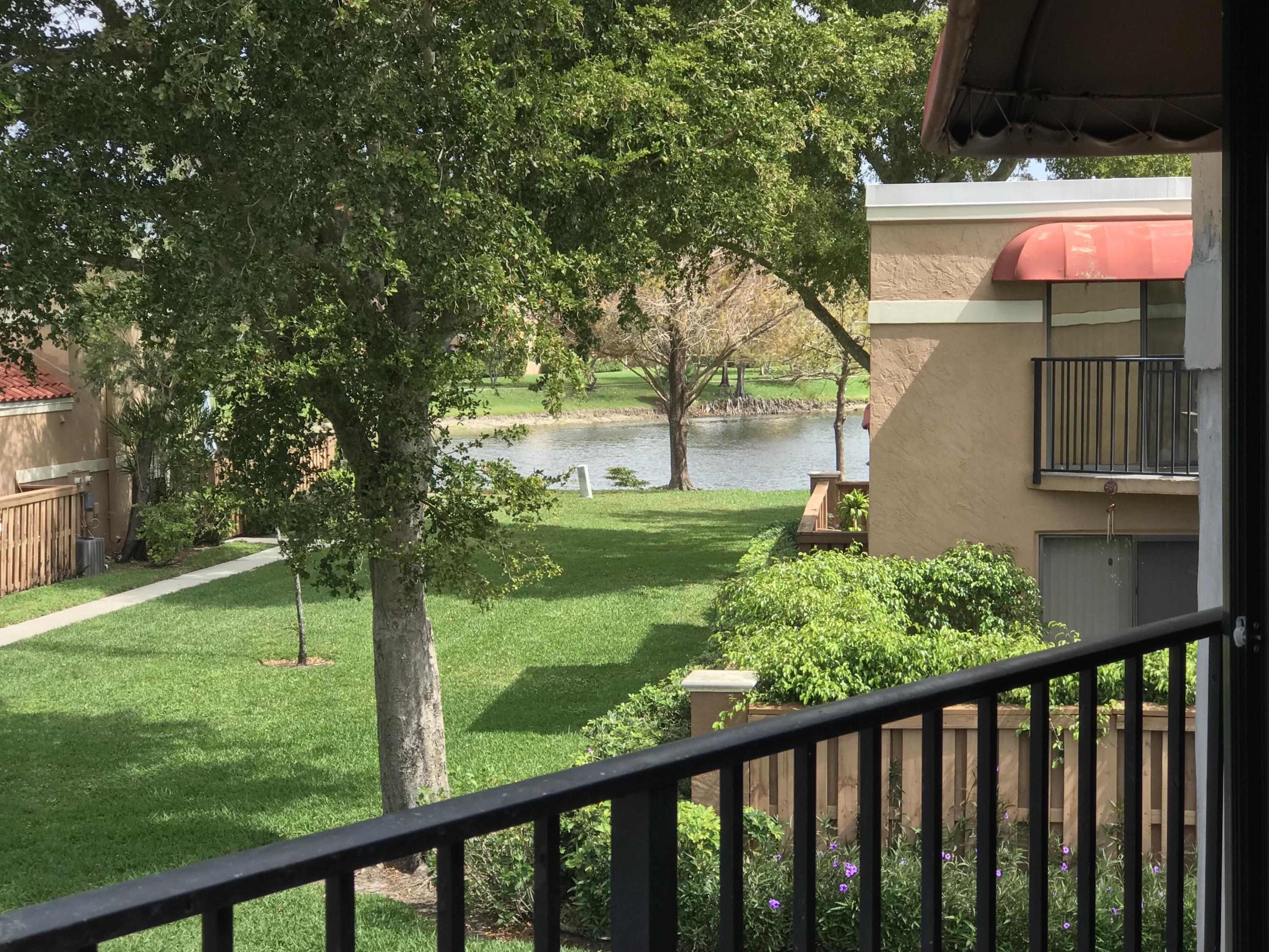 8249 Thames Boulevard, Unit B Boca Raton, FL 33433 - Photo 28 of 46 a view of a porch with a yard