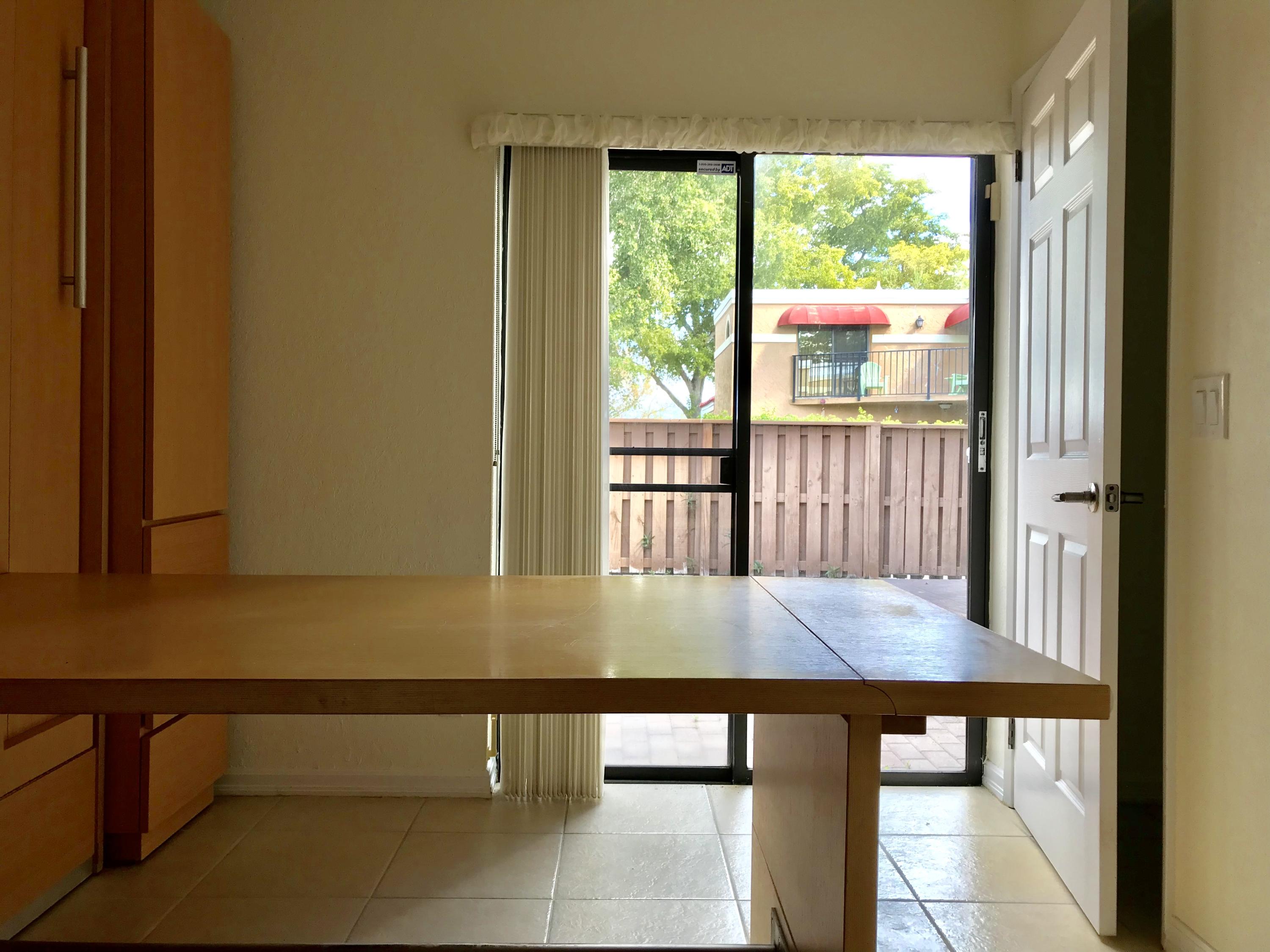 8249 Thames Boulevard, Unit B Boca Raton, FL 33433 - Photo 31 of 46 a view of a furniture window and wooden floor