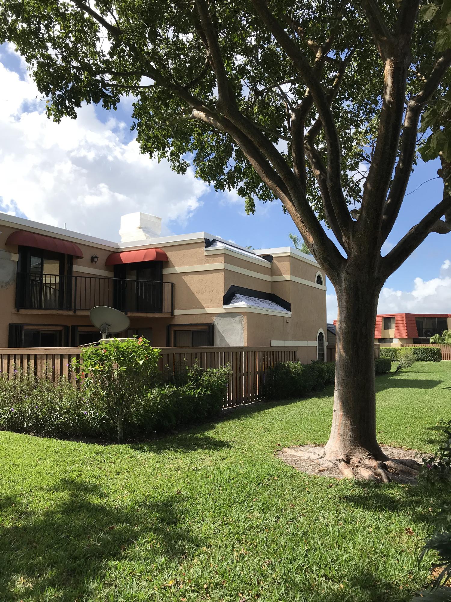 8249 Thames Boulevard, Unit B Boca Raton, FL 33433 - Photo 34 of 46 a front view of a house with garden