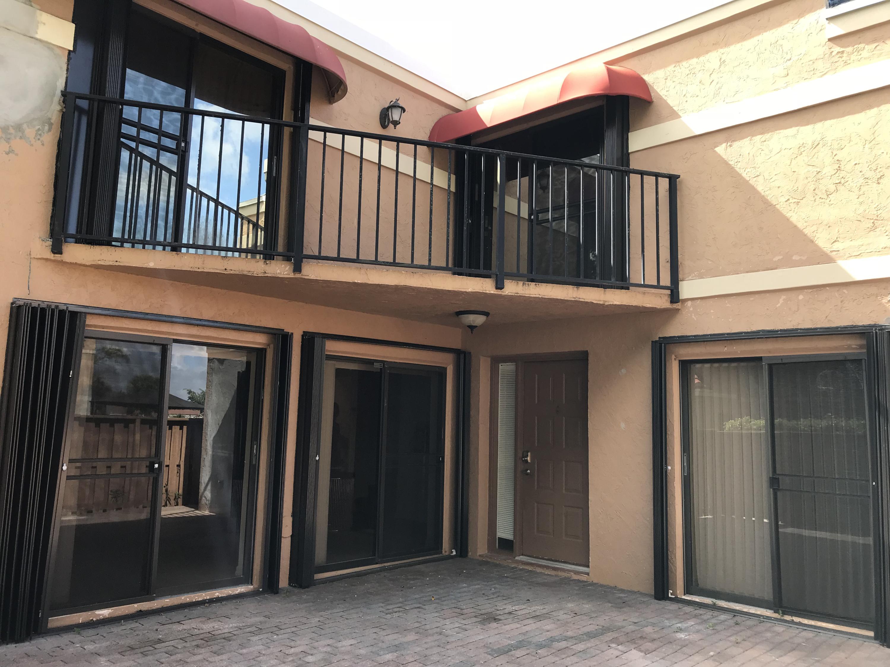 8249 Thames Boulevard, Unit B Boca Raton, FL 33433 - Photo 36 of 46 a view of a house with a porch