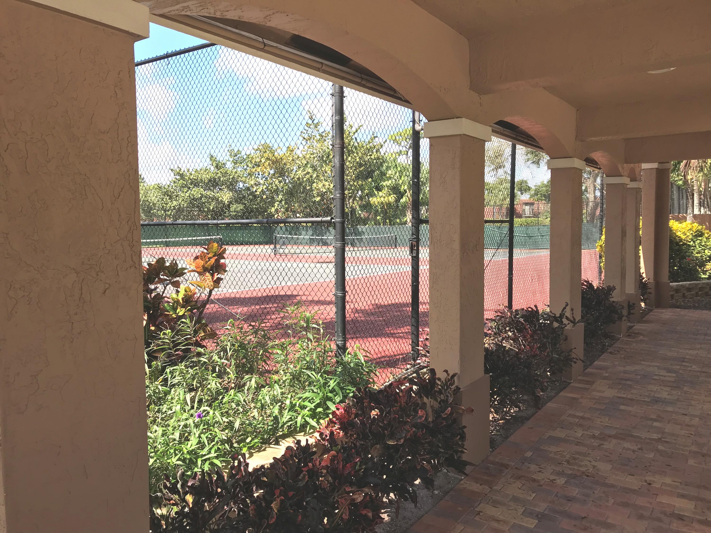 8249 Thames Boulevard, Unit B Boca Raton, FL 33433 - Photo 40 of 46 a view of a porch with a potted plant
