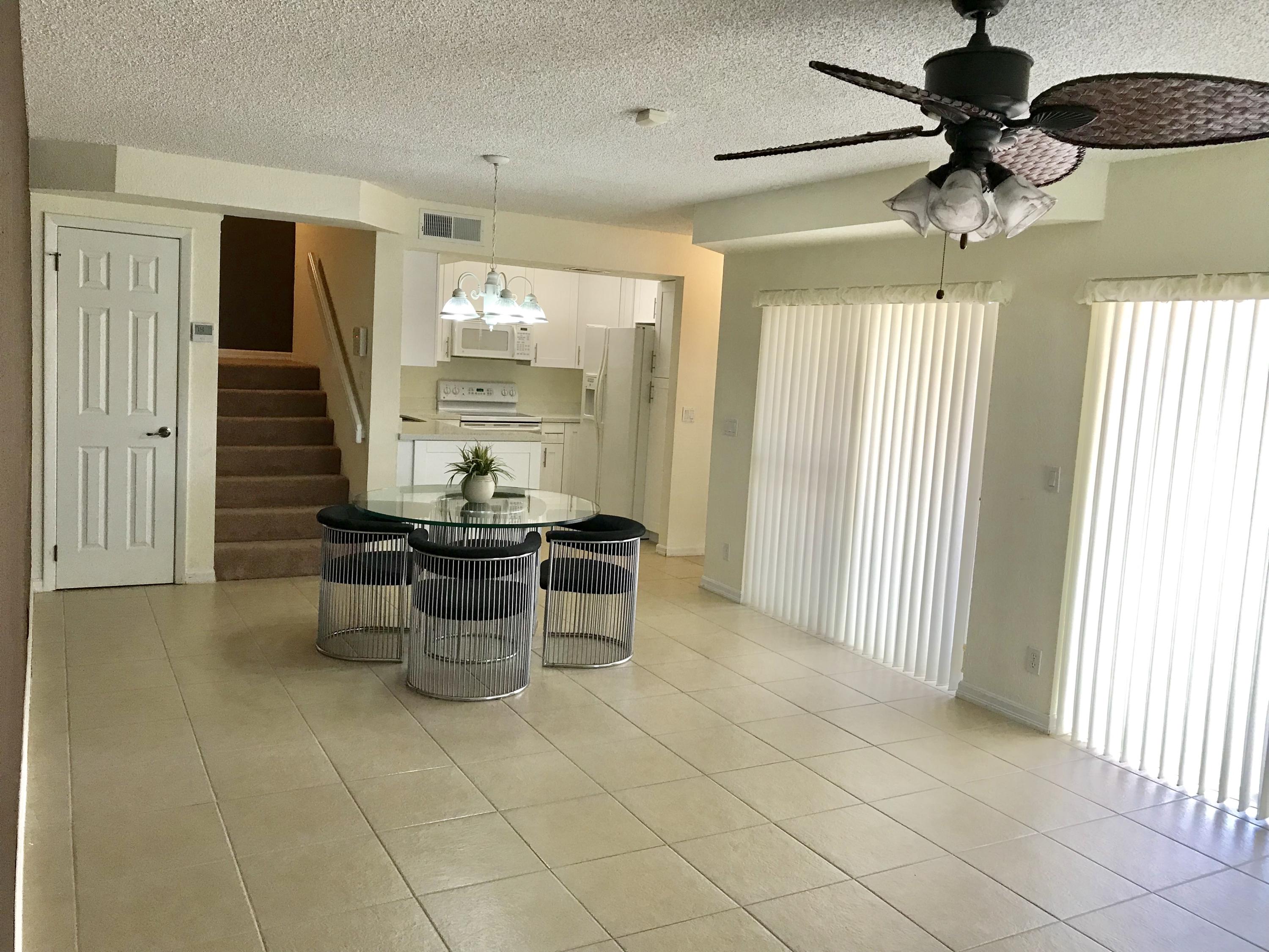 8249 Thames Boulevard, Unit B Boca Raton, FL 33433 - Photo 8 of 46 a kitchen with a sink cabinets and window