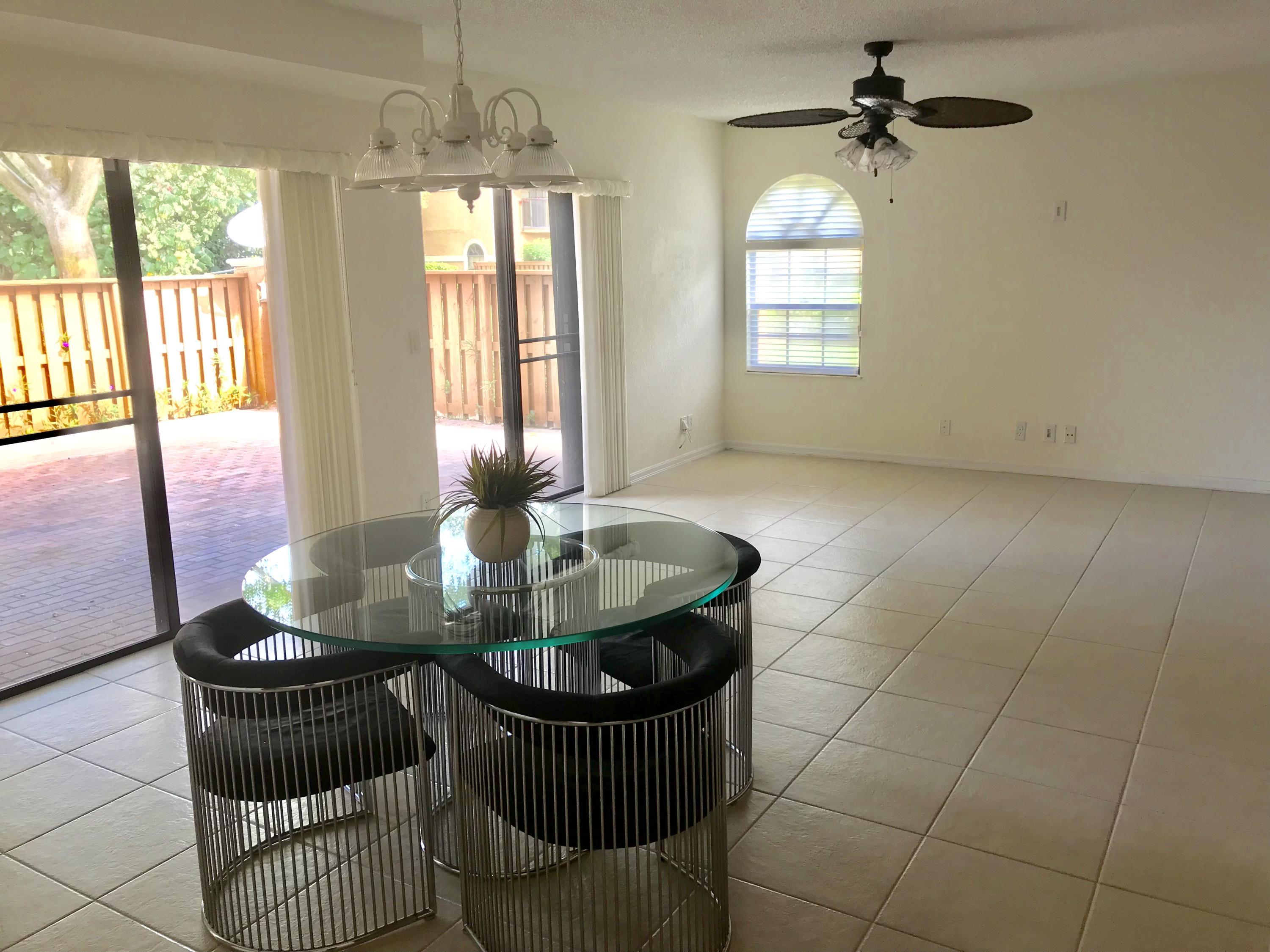 8249 Thames Boulevard, Unit B Boca Raton, FL 33433 - Photo 9 of 46 a dining room with furniture and window