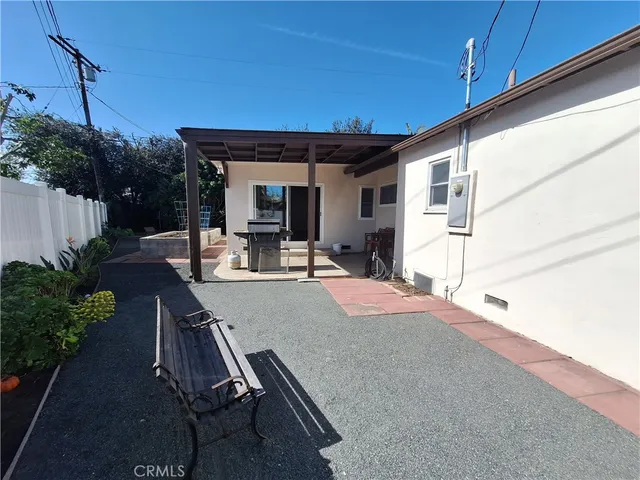 a view of a patio with table and chairs potted plants with wooden floor