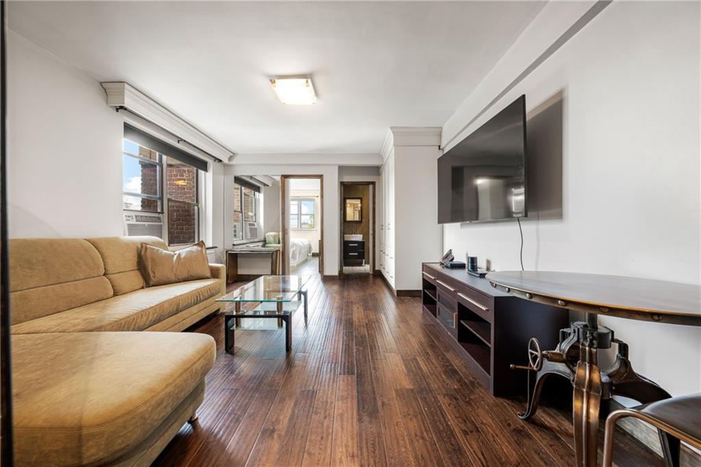 2615 Avenue O, Unit 6C Brooklyn, NY 11210 - Photo 5 of 10 a living room with furniture and a flat screen tv