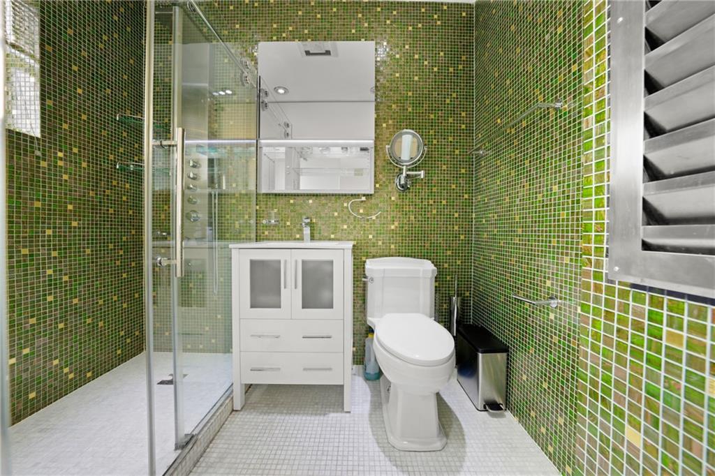 2615 Avenue O, Unit 6C Brooklyn, NY 11210 - Photo 8 of 10 a bathroom with a toilet and a shower