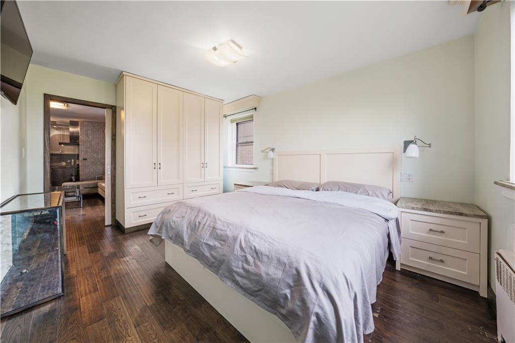 2615 Avenue O, Unit 6C Brooklyn, NY 11210 - Photo 9 of 10 a bedroom with a bed and wooden floor