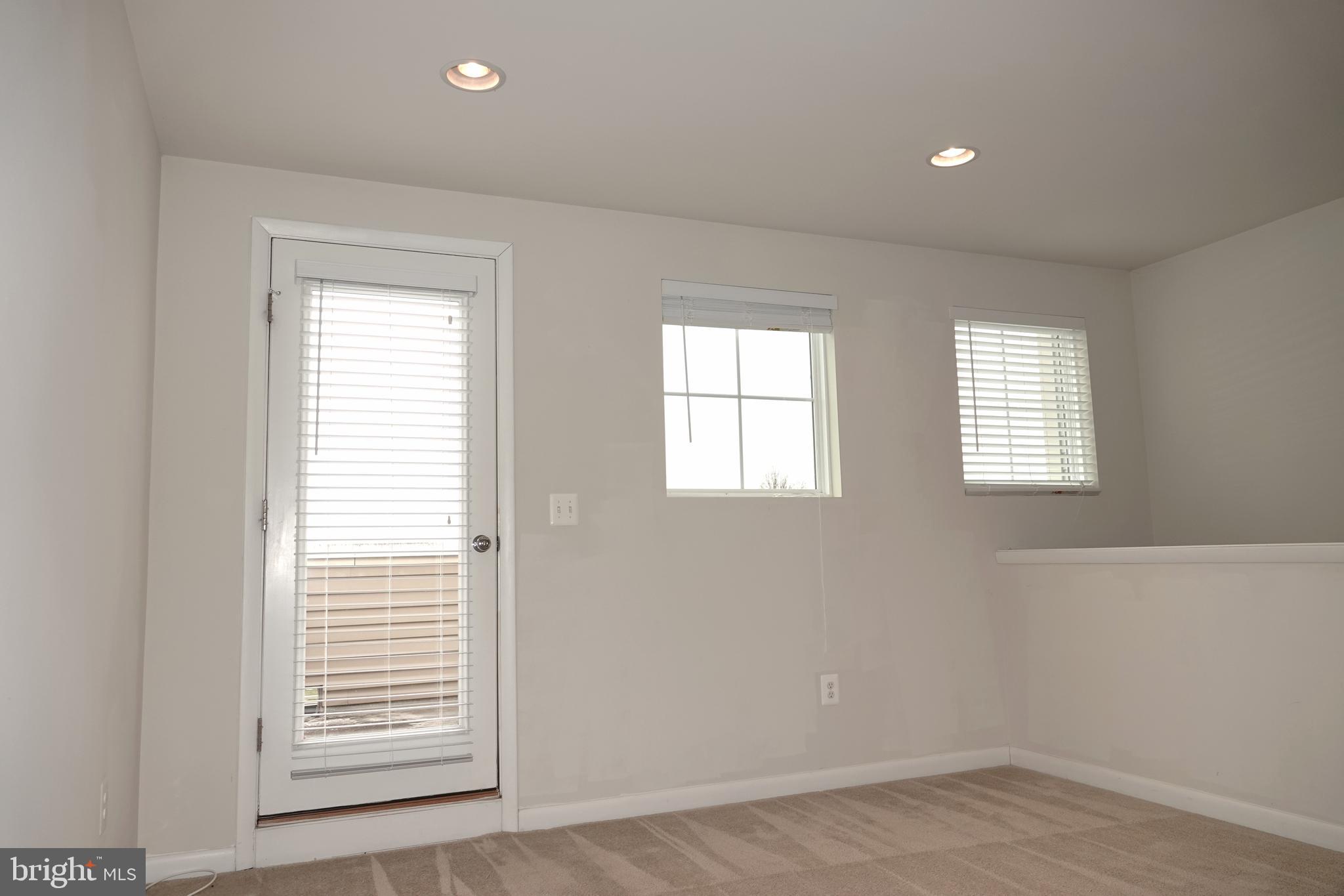 110 Strummer Lane Gaithersburg, MD 20878 - Photo 21 of 22 an empty room with windows