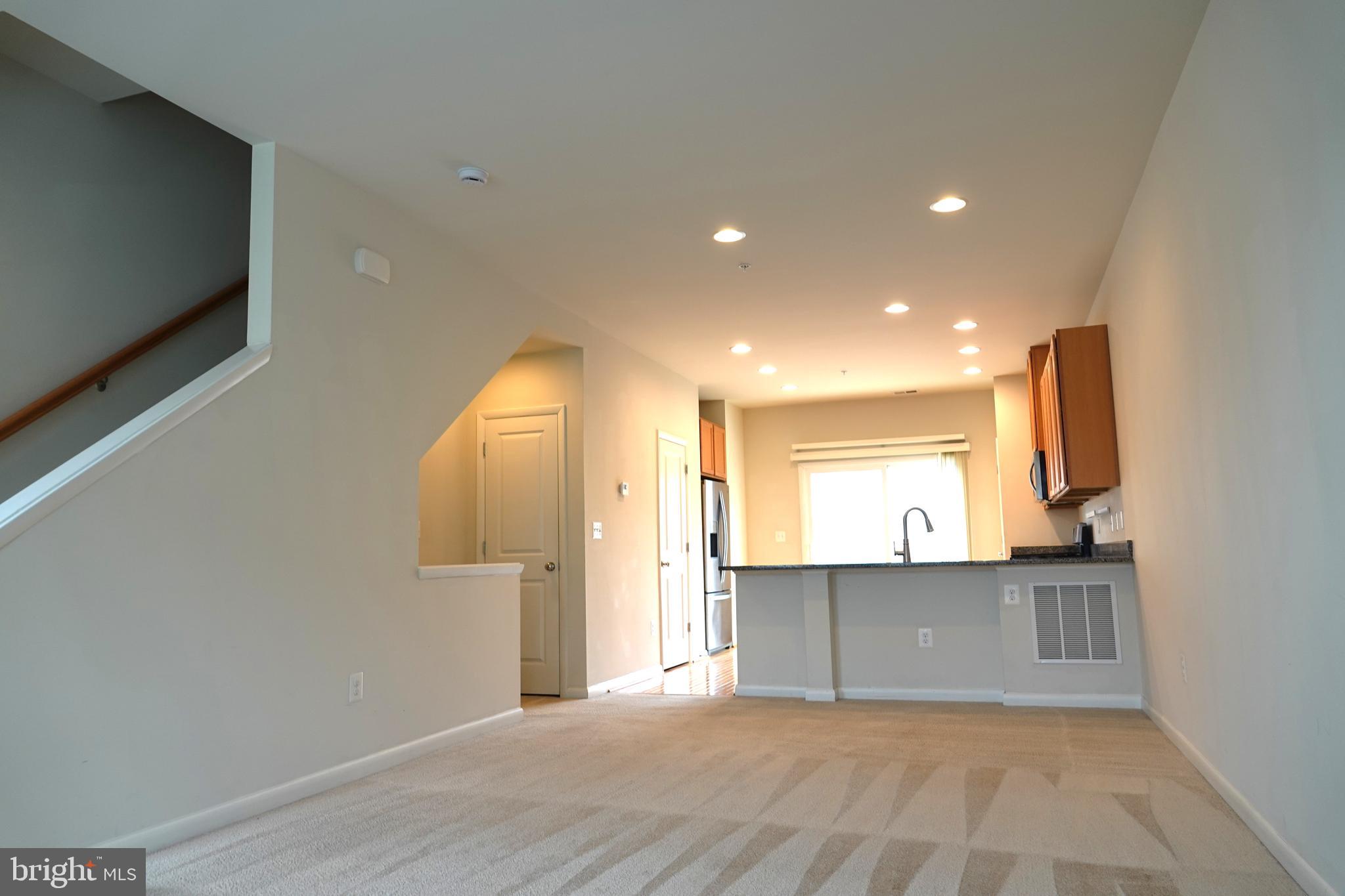 110 Strummer Lane Gaithersburg, MD 20878 - Photo 3 of 22 a view of a kitchen with a sink and a window