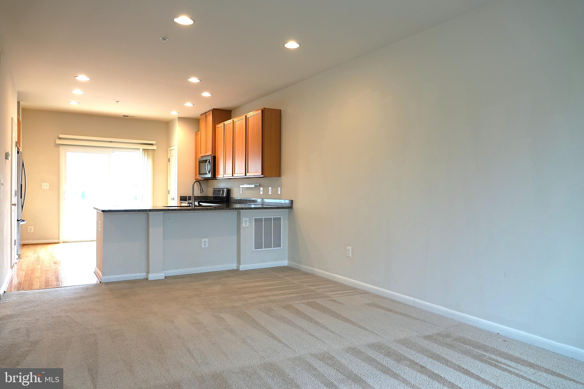 110 Strummer Lane Gaithersburg, MD 20878 - Photo 5 of 22 a view of kitchen with granite countertop cabinets and sink
