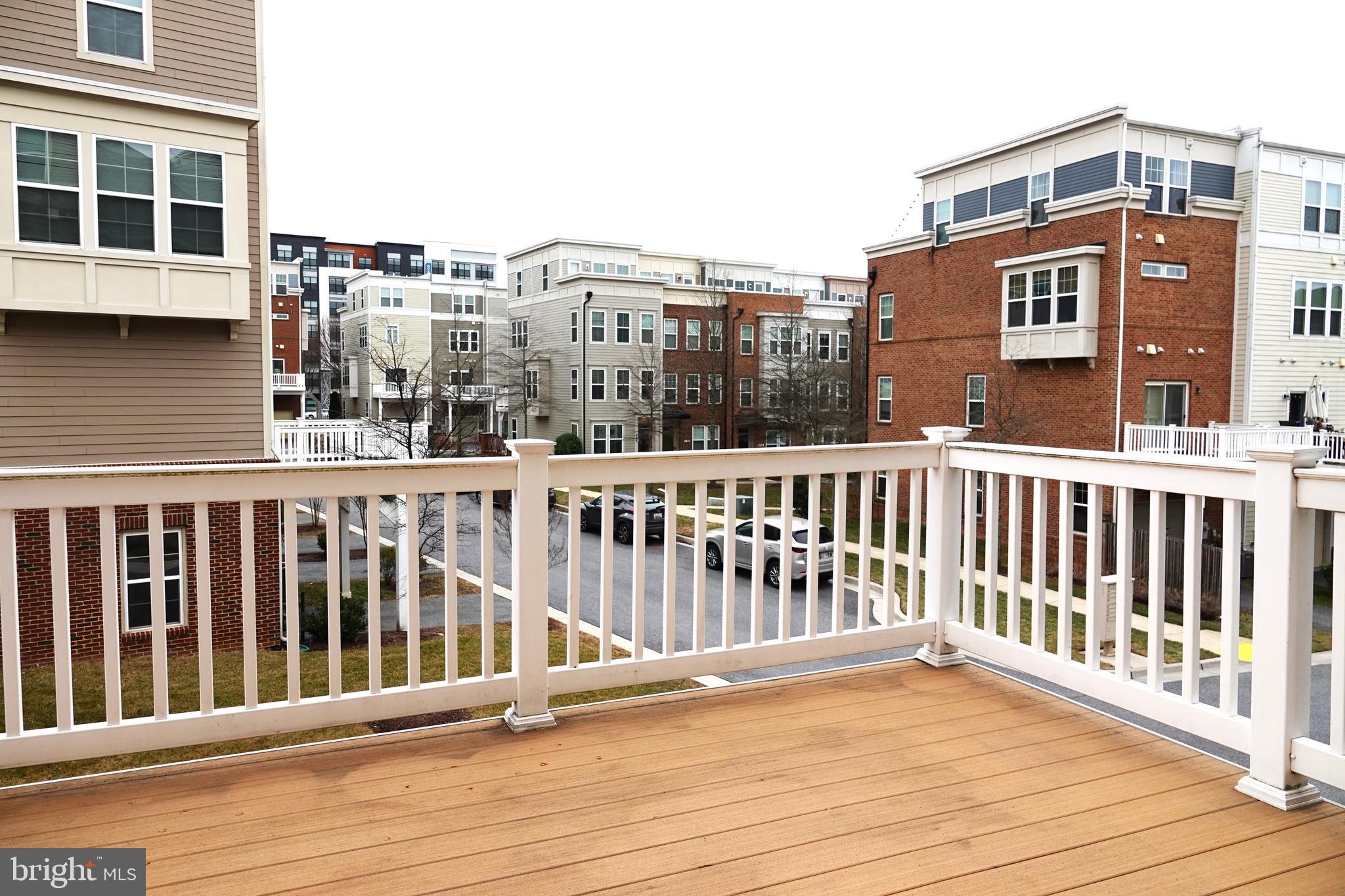 110 Strummer Lane Gaithersburg, MD 20878 - Photo 9 of 22 a view of a balcony with wooden floor