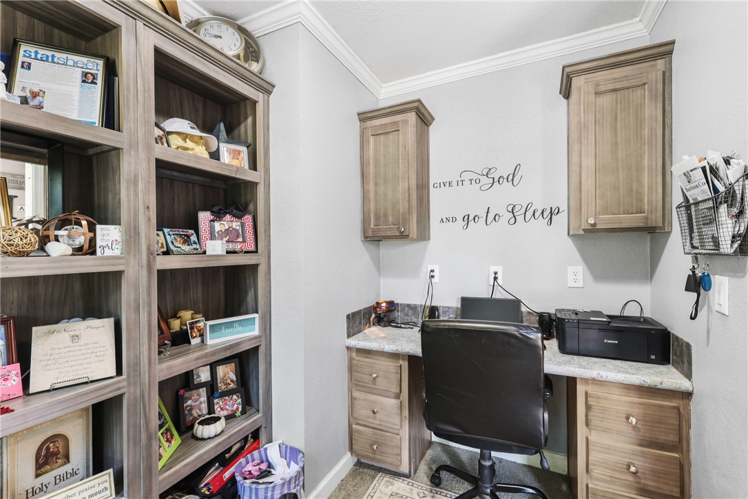 735 Boysenberry Road Somerville, TX 77879 - Photo 15 of 27 a view of a workspace with furniture and cabinet
