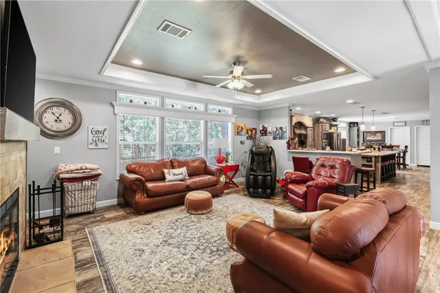 a living room with furniture a clock and a clock