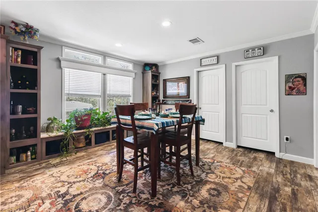 a view of a dining room with furniture window and outside view
