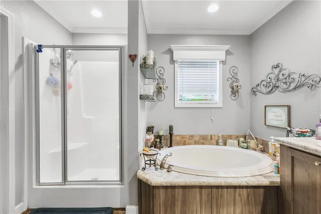 a bathroom with a sink a mirror and a shower