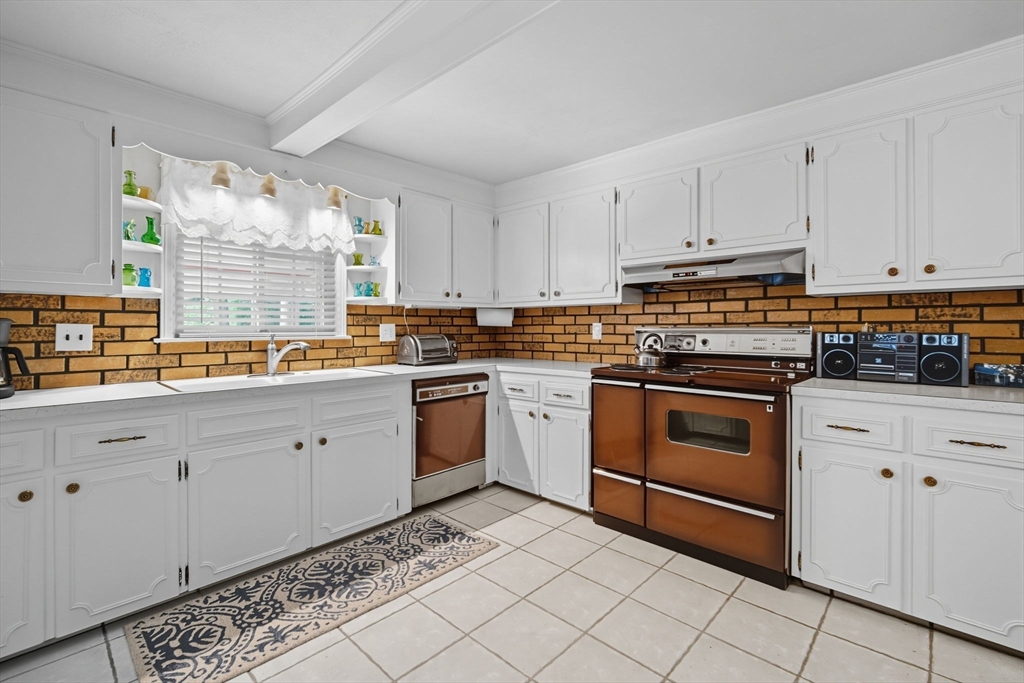 43 Greenleaf Avenue West Springfield, MA 01089 - Photo 12 of 37 a kitchen with granite countertop white cabinets and white appliances
