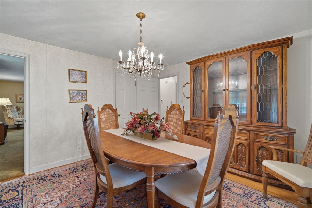 43 Greenleaf Avenue West Springfield, MA 01089 - Photo 15 of 37 a view of a dining room with furniture wooden floor and a chandelier