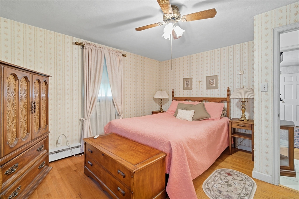 43 Greenleaf Avenue West Springfield, MA 01089 - Photo 16 of 37 a bedroom with bed and wooden floor