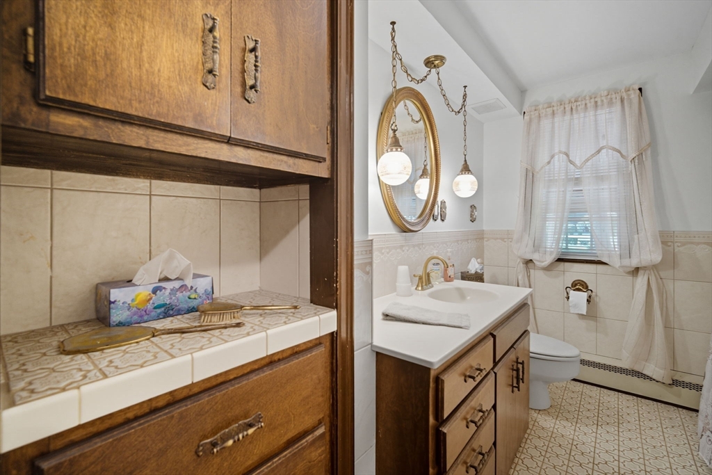 43 Greenleaf Avenue West Springfield, MA 01089 - Photo 18 of 37 a bathroom with a sink and a mirror