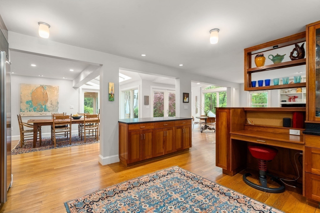 33 Manchester Road Newton, MA 02461 - Photo 11 of 31 a living room with fireplace furniture and a wooden floor