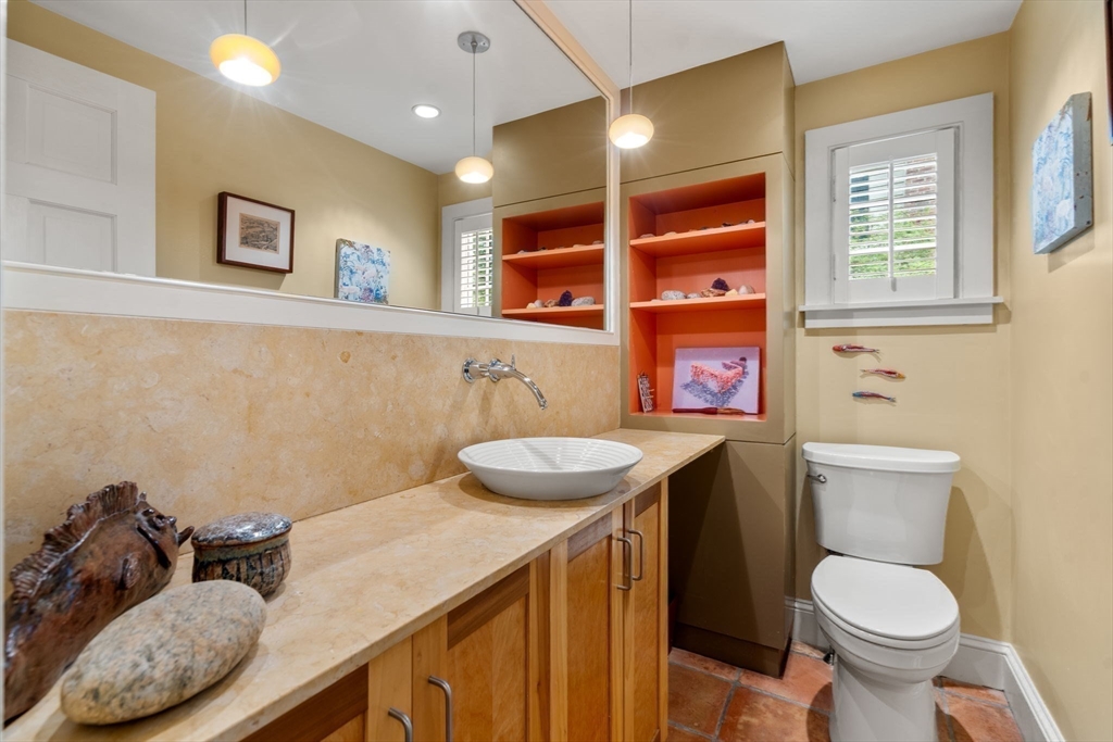 33 Manchester Road Newton, MA 02461 - Photo 21 of 31 a bathroom with a sink a toilet and a window
