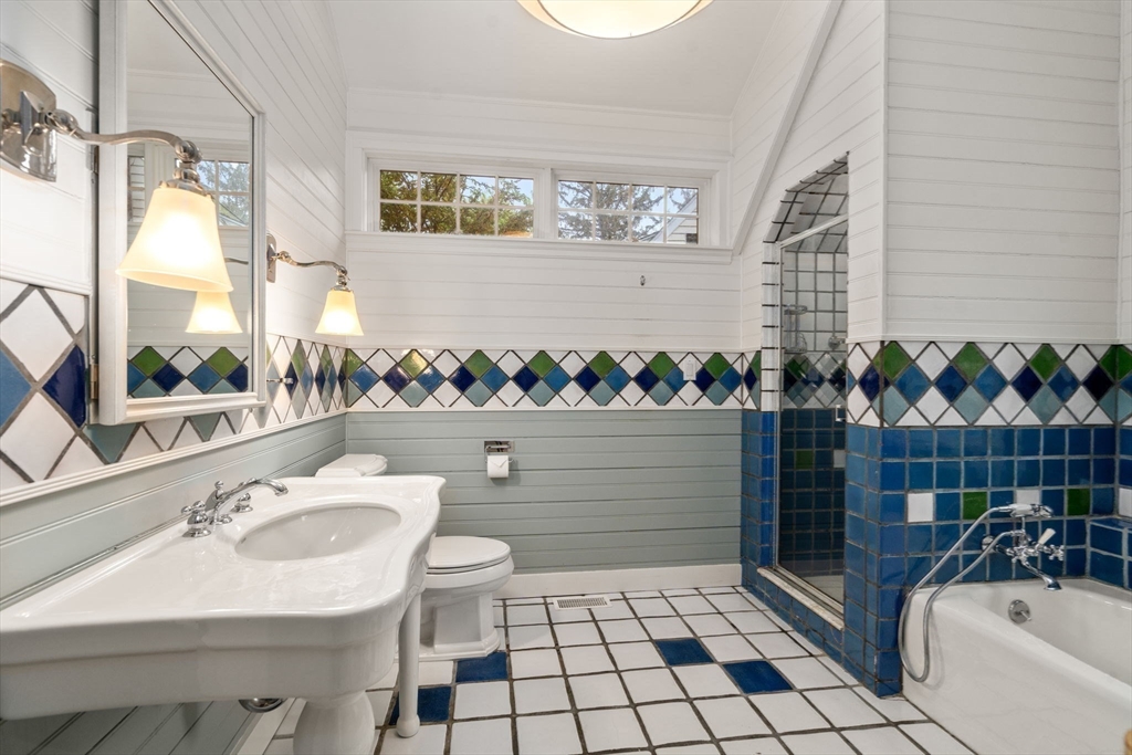 33 Manchester Road Newton, MA 02461 - Photo 22 of 31 a bathroom with a sink a toilet and shower