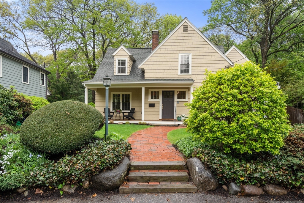 33 Manchester Road Newton, MA 02461 - Photo 30 of 31 a front view of a house with a yard and potted plants