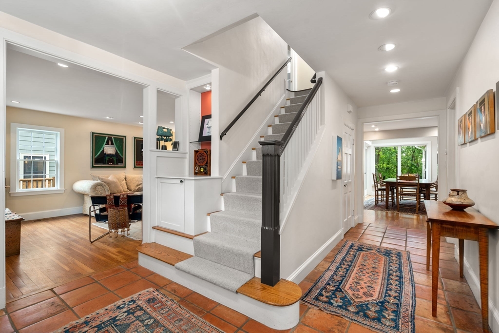 33 Manchester Road Newton, MA 02461 - Photo 3 of 31 a living room with furniture and a table