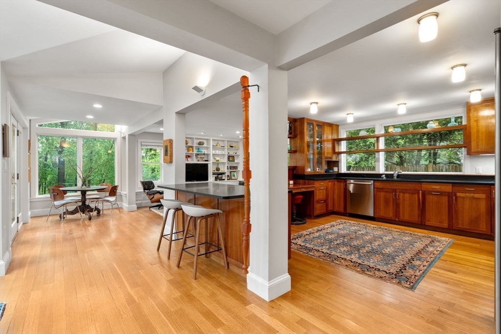 33 Manchester Road Newton, MA 02461 - Photo 7 of 31 a living room with couches and kitchen view with wooden floor