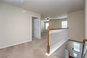 a view of a hallway view with staircase