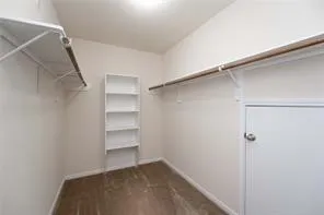 a view of an empty walk in closet