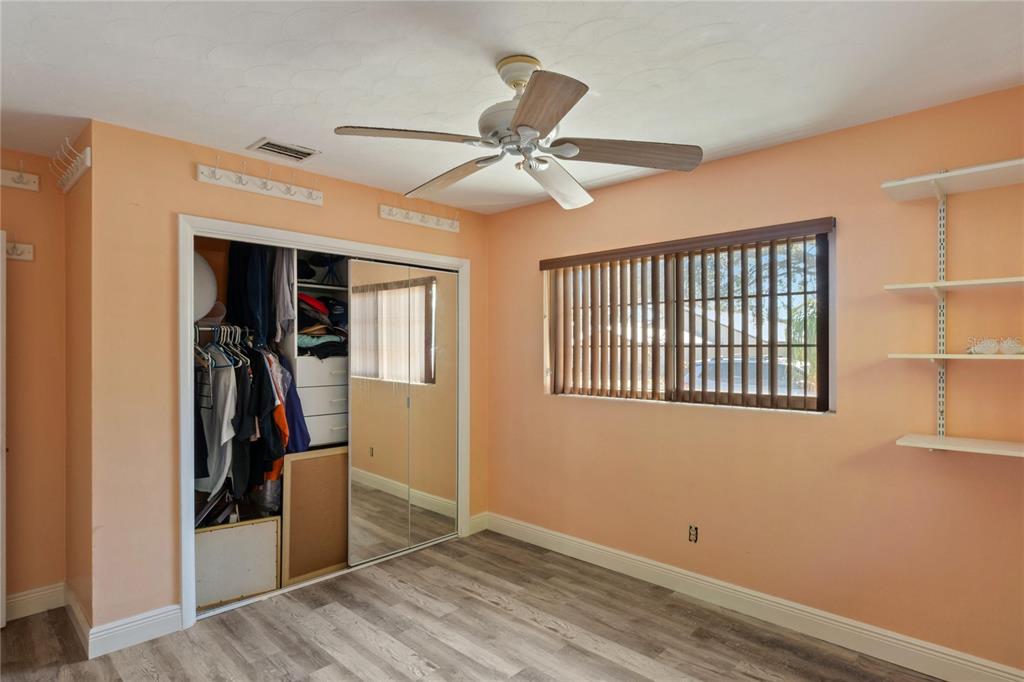 820 3rd Avenue Southwest Largo, FL 33770 - Photo 13 of 25 a view of a livingroom with a window and a ceiling fan