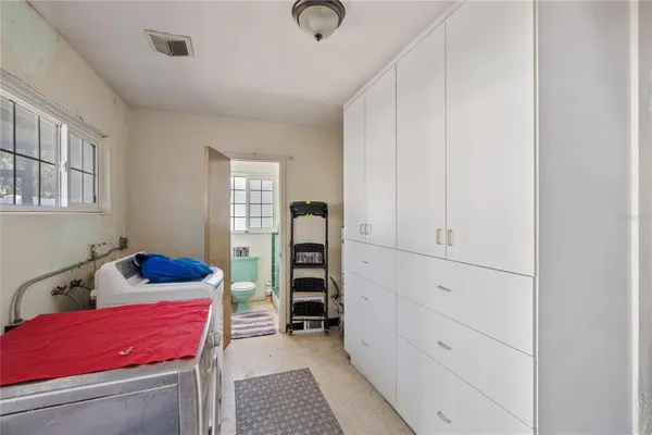 a bed room with a bed and a window