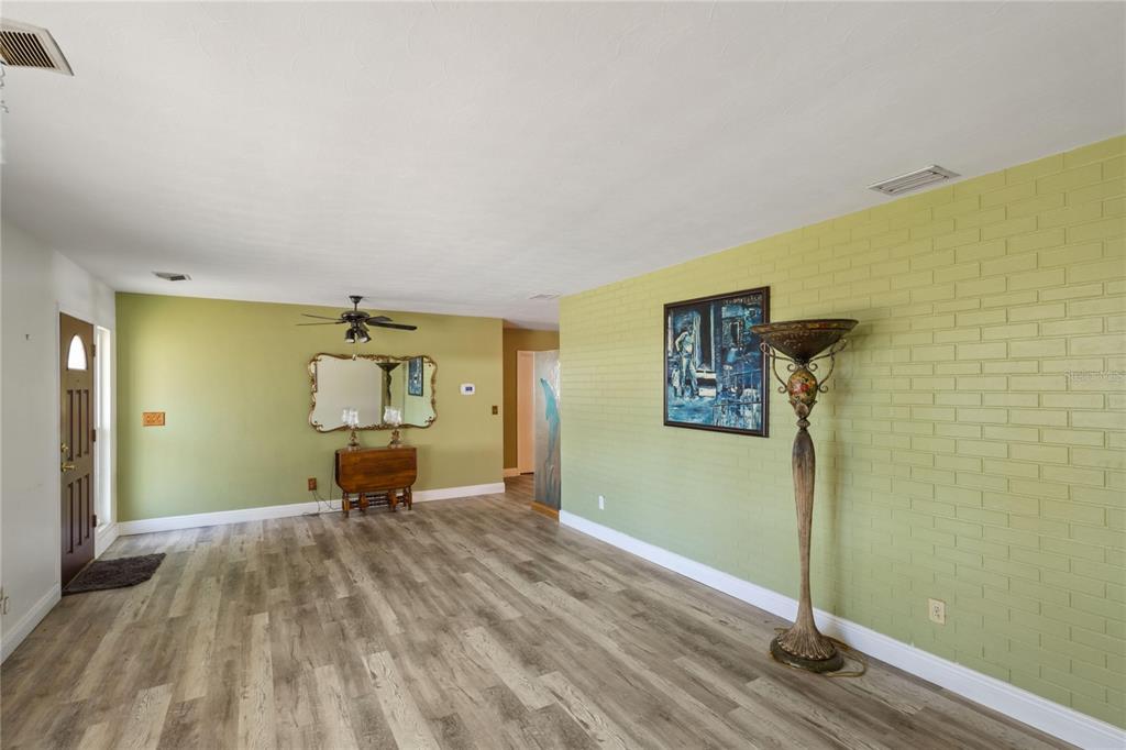 820 3rd Avenue Southwest Largo, FL 33770 - Photo 4 of 25 a view of a bedroom with wooden floor