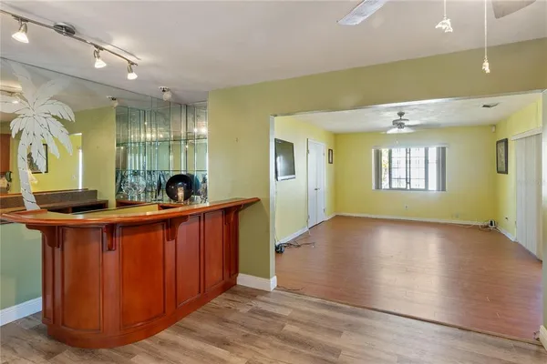 a view of a bathroom with double vanity and a mirror