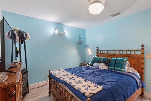 a bedroom with a bed and dresser