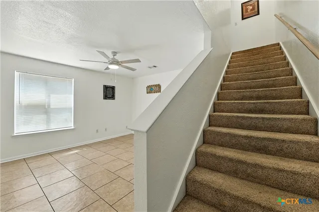 a bathroom with a sink a mirror a bathtub and a toilet