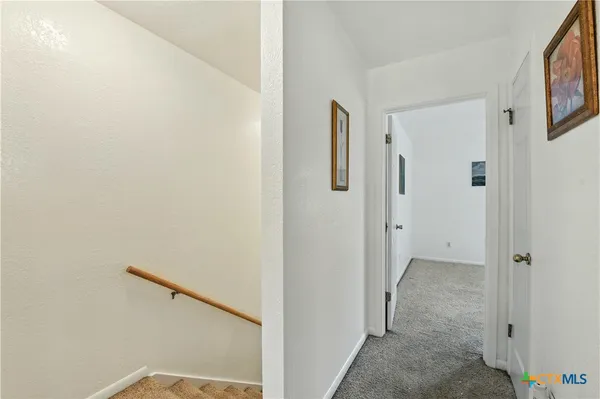 a view of a bathroom from the hallway