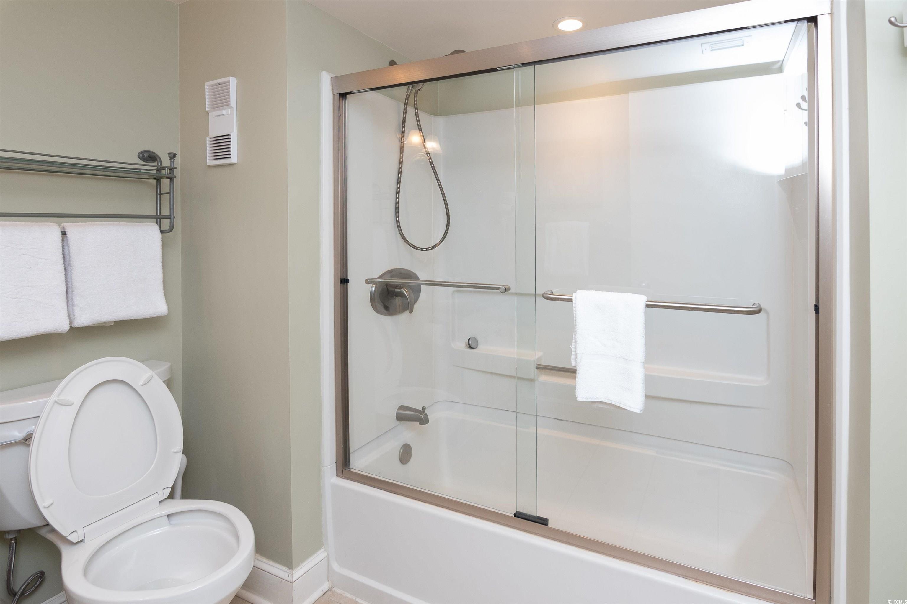 9820 Queensway Boulevard, Unit 1006 Myrtle Beach, SC 29572 - Photo 22 of 30 Bathroom with combined bath / shower with glass door and baseboards