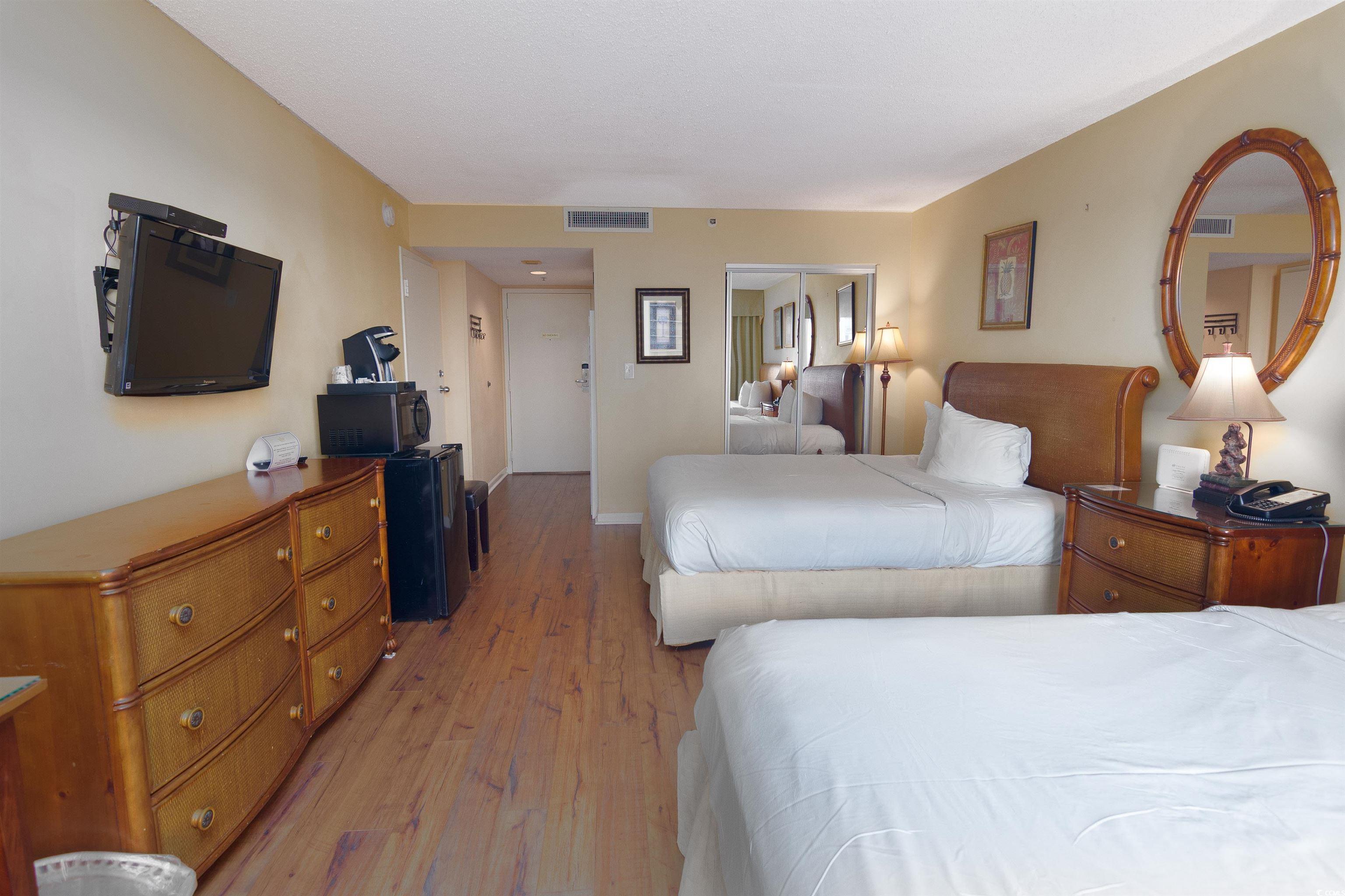 9820 Queensway Boulevard, Unit 1006 Myrtle Beach, SC 29572 - Photo 29 of 30 Bedroom with a closet and light wood-style flooring