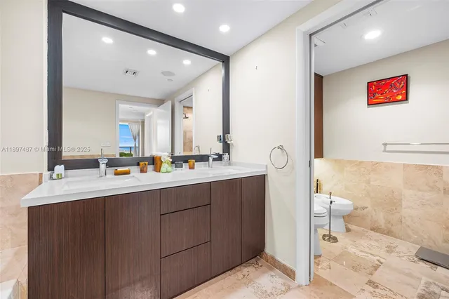a bathroom with a double vanity sink and a mirror