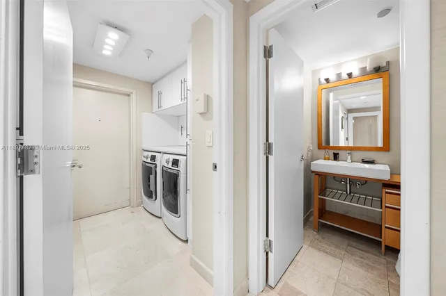 a view of a hallway with washer and dryer
